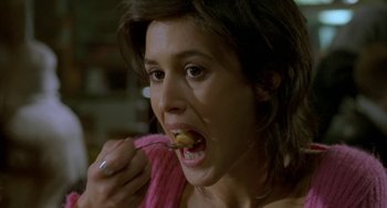 Movie still from “Read My Lips” (2001), directed by Jacques Audiard – A person eating food from a spoon; Close Up shot, High angle