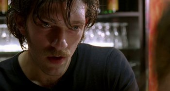 Movie still from “Read My Lips” (2001), directed by Jacques Audiard – A person with a mustache; Close Up shot, Low angle