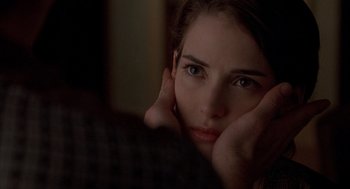 Movie still from “Reality Bites” (1994), directed by Ben Stiller – A person with her hands on her face; Close Up shot, Over the shoulder angle