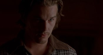 Movie still from “Reality Bites” (1994), directed by Ben Stiller – A person with long hair; Close Up shot, Over the shoulder angle