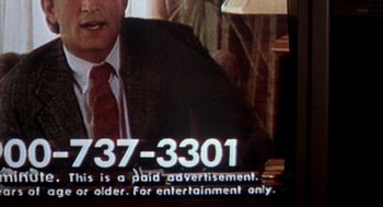Movie still from “Reality Bites” (1994), directed by Ben Stiller – A television screen with a call sign on it; Extreme Close Up shot, High angle