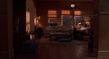 Movie still from “Reality Bites” (1994), directed by Ben Stiller – A living room filled with lots of furniture and windows; Extreme Wide shot, High angle