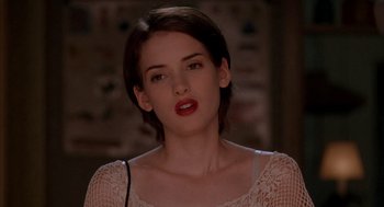 Movie still from “Reality Bites” (1994), directed by Ben Stiller – A person with short brown hair; Close Up shot, Over the shoulder angle