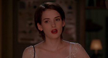 Movie still from “Reality Bites” (1994), directed by Ben Stiller – A person with short brown hair; Close Up shot, Over the shoulder angle