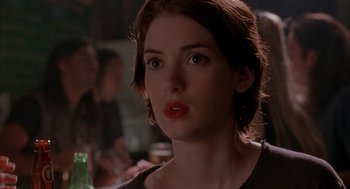 Movie still from “Reality Bites” (1994), directed by Ben Stiller – A person with a drink; Close Up shot, Over the shoulder angle
