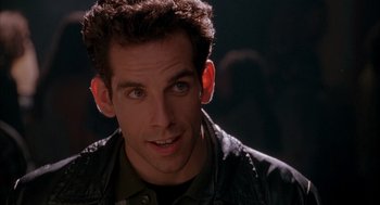 Movie still from “Reality Bites” (1994), directed by Ben Stiller – A person wearing a leather jacket; Close Up shot, Over the shoulder angle