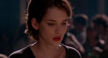 Movie still from “Reality Bites” (1994), directed by Ben Stiller – A person with short brown hair; Close Up shot, Low angle