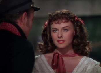 Movie still from “Reap the Wild Wind” (1942), directed by Cecil B. DeMille – A man and a woman are looking at one another; Close Up shot, Over the shoulder angle