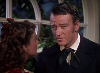 Movie still from “Reap the Wild Wind” (1942), directed by Cecil B. DeMille – A man and a woman are talking to each other; Close Up shot, Over the shoulder angle