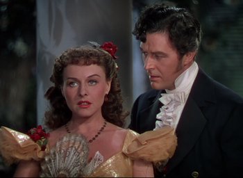 Movie still from “Reap the Wild Wind” (1942), directed by Cecil B. DeMille – A man and a woman standing next to each other; Close Up shot, Over the shoulder angle