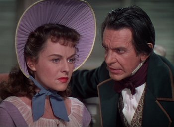 Movie still from “Reap the Wild Wind” (1942), directed by Cecil B. DeMille – A man and a woman standing next to each other; Close Up shot, Over the shoulder angle