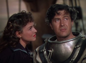 Movie still from “Reap the Wild Wind” (1942), directed by Cecil B. DeMille – A man and a woman standing next to each other; Close Up shot, Over the shoulder angle