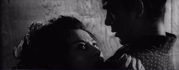 Movie still from “Red Beard” (1965), directed by Akira Kurosawa – A man and a woman face to face in a black and white photo; Extreme Close Up shot, Over the shoulder angle