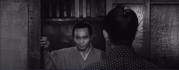 Movie still from “Red Beard” (1965), directed by Akira Kurosawa – A man in a kimono looking in the mirror; Medium shot, Over the shoulder angle
