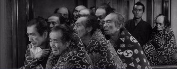 Movie still from “Red Beard” (1965), directed by Akira Kurosawa – A group of people with their heads wrapped in blankets; Medium shot, High angle