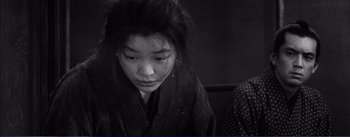 Movie still from “Red Beard” (1965), directed by Akira Kurosawa – A young woman wearing a kimono looking down at her face; Close Up shot, High angle