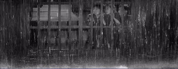 Movie still from “Red Beard” (1965), directed by Akira Kurosawa – A group of children looking out of a jail cell; Wide shot, High angle