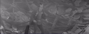 Movie still from “Red Beard” (1965), directed by Akira Kurosawa – A man is walking through a pile of rubble; Wide shot, High angle