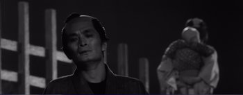 Movie still from “Red Beard” (1965), directed by Akira Kurosawa – A black and white photo of a man looking up; Close Up shot, Low angle