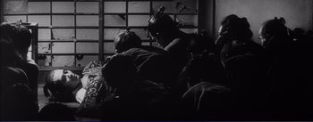 Movie still from “Red Beard” (1965), directed by Akira Kurosawa – A black and white photo of a group of people; Wide shot, High angle