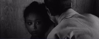 Movie still from “Red Beard” (1965), directed by Akira Kurosawa – A young man and a young woman looking at one another; Close Up shot, Over the shoulder angle