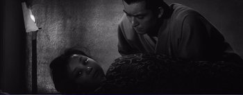 Movie still from “Red Beard” (1965), directed by Akira Kurosawa – A man and a woman are looking at each other; Close Up shot, High angle