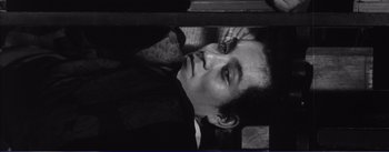 Movie still from “Red Beard” (1965), directed by Akira Kurosawa – Black and white photograph of a young man looking at the camera; Close Up shot, High angle