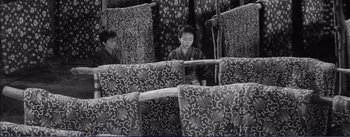 Movie still from “Red Beard” (1965), directed by Akira Kurosawa – Two women sitting on a bus in the middle of the day; Wide shot, High angle