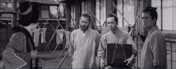 Movie still from “Red Beard” (1965), directed by Akira Kurosawa – A black and white photo of two men standing next to each other; Medium shot, Low angle