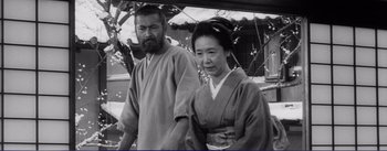 Movie still from “Red Beard” (1965), directed by Akira Kurosawa – An older man and a younger woman dressed in traditional japanese garb; Medium shot, Low angle
