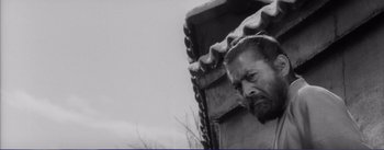 Movie still from “Red Beard” (1965), directed by Akira Kurosawa – A black and white photo of a man with a beard; Close Up shot, Low angle