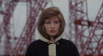 Movie still from “Red Desert” (1964), directed by Michelangelo Antonioni – A person wearing a jacket; Close Up shot, Low angle