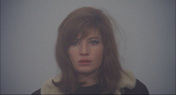 Movie still from “Red Desert” (1964), directed by Michelangelo Antonioni – A person wearing a fur coat; Close Up shot, High angle