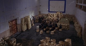 Movie still from “Red Desert” (1964), directed by Michelangelo Antonioni – A group of people sitting around in a room; Extreme Wide shot, High angle