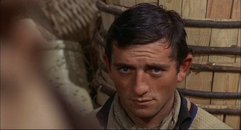 Movie still from “Red Desert” (1964), directed by Michelangelo Antonioni – A person wearing a hat; Close Up shot, Over the shoulder angle