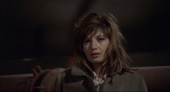 Movie still from “Red Desert” (1964), directed by Michelangelo Antonioni – A person wearing a jacket; Close Up shot, High angle