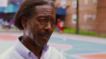 Movie still from “Red Hook Summer” (2012), directed by Spike Lee – An older black man looking at the camera; Close Up shot, Over the shoulder angle