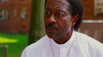 Movie still from “Red Hook Summer” (2012), directed by Spike Lee – A person wearing a white shirt; Close Up shot, Over the shoulder angle