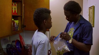 Movie still from “Red Hook Summer” (2012), directed by Spike Lee – A man and a boy looking at each other; Medium shot, Over the shoulder angle