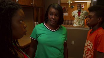 Movie still from “Red Hook Summer” (2012), directed by Spike Lee – A woman in a green shirt standing next to another woman in a green shirt; Medium shot, Over the shoulder angle