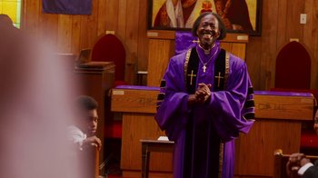 Movie still from “Red Hook Summer” (2012), directed by Spike Lee – A man in a purple robe and a boy in a purple robe; Medium shot, Low angle