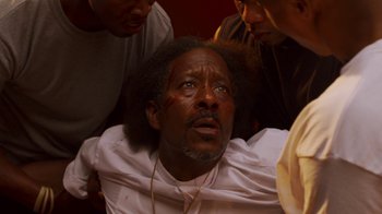 Movie still from “Red Hook Summer” (2012), directed by Spike Lee – A man with a bandage on his head and face; Close Up shot, High angle