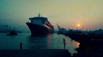 Movie still from “Red Hook Summer” (2012), directed by Spike Lee – A cruise ship docked at a pier at sunset; Extreme Wide shot, Low angle