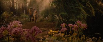 Movie still from “Red Riding Hood” (2011), directed by Catherine Hardwicke – A couple of people are walking through a forest; Wide shot, High angle