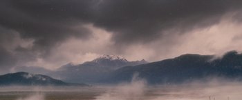 Movie still from “Red Riding Hood” (2011), directed by Catherine Hardwicke – A cloudy sky over a body of water with mountains in the background; Extreme Wide shot, Low angle