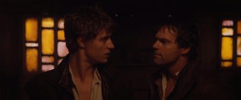 Movie still from “Red Riding Hood” (2011), directed by Catherine Hardwicke – Two men looking at one another in the dark; Close Up shot, Over the shoulder angle