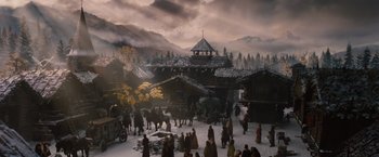 Movie still from “Red Riding Hood” (2011), directed by Catherine Hardwicke – A group of people standing in front of a building; Extreme Wide shot, High angle