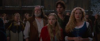 Movie still from “Red Riding Hood” (2011), directed by Catherine Hardwicke – A group of people standing next to each other in the snow; Medium shot, Low angle