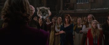 Movie still from “Red Riding Hood” (2011), directed by Catherine Hardwicke – A group of people standing in a room; Medium shot, Over the shoulder angle