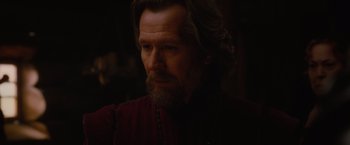 Movie still from “Red Riding Hood” (2011), directed by Catherine Hardwicke – A person with long hair and a beard; Close Up shot, Over the shoulder angle